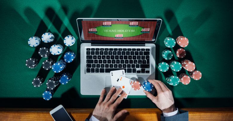 laptop casino, gambling chips and cards
